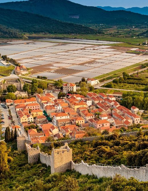Aerial view of Ston, its great defensive walls and the salt pans on the Pelješac peninsula